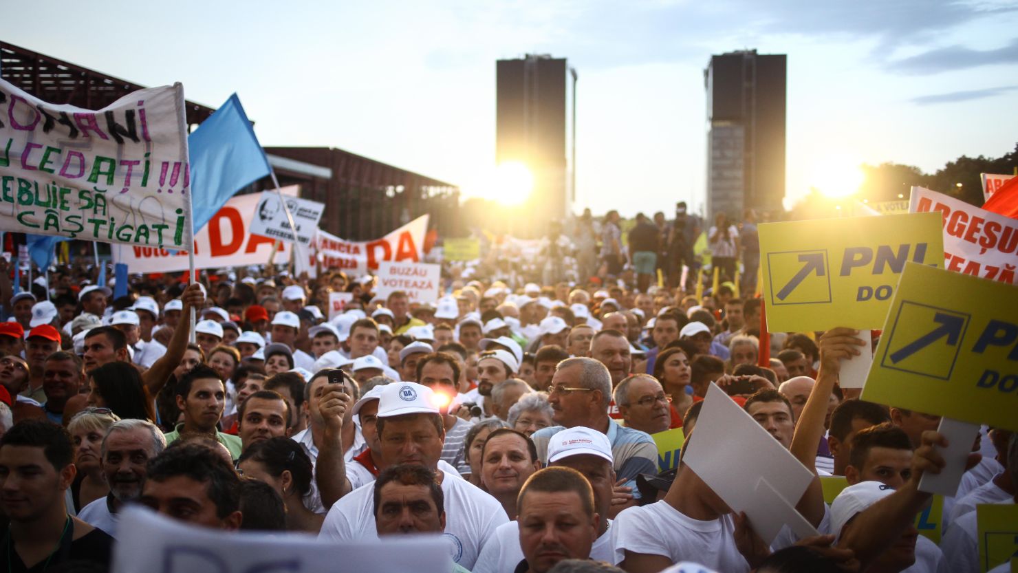 Supporters of Romanian PM Victor Ponta listen to him at a rally in Bucharest Thursday in favor of impeaching the president.