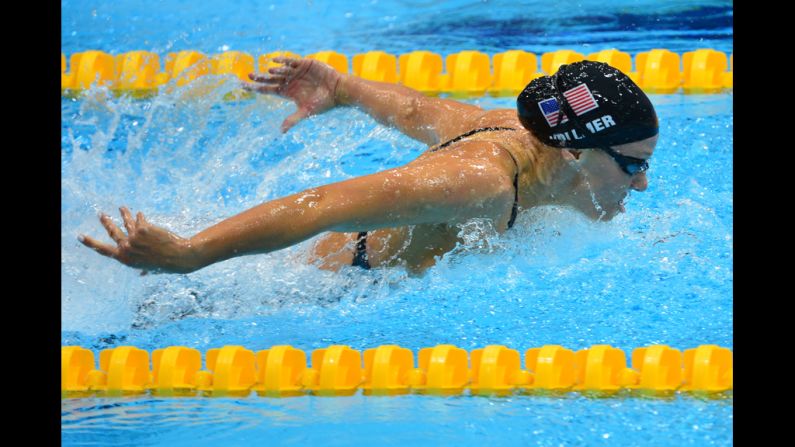 Vollmer set a world record in winning the 100-meter butterfly, becoming the first woman to go under 56 seconds.