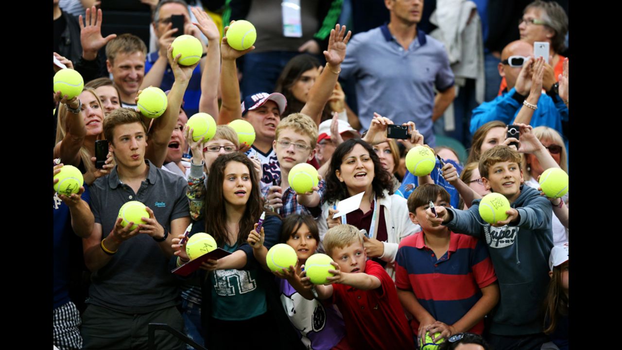 Tennis fans celebrate their favorite sport with a giveaway of Super Tennis Balls. Things didn't go over as well at the shot put field.