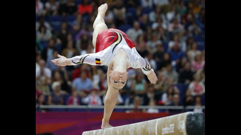 Belgian gymnast Gaelle Mys competes on the balance beam during the women's artistic gymnastics qualification event. Check out photos from <a href="index.php?page=&url=http%3A%2F%2Fwww.cnn.com%2F2012%2F07%2F30%2Fworldsport%2Fgallery%2Folympics-day-three%2F" target="_blank">Day 3 of the competition.</a>