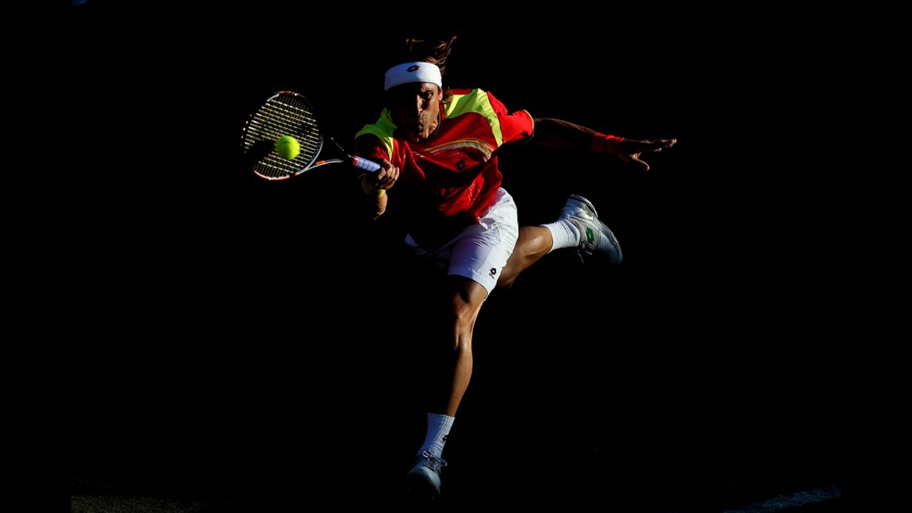 David Ferrer of Spain plays a forehand shot during the men's singles tennis match against Vasek Pospisil of Canada.