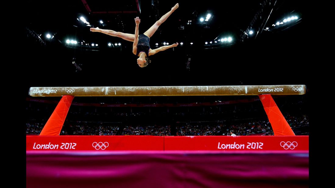 Laura Svilpaite of Lithuania competes on the beam during the artistic gymnastics women's team qualification round.