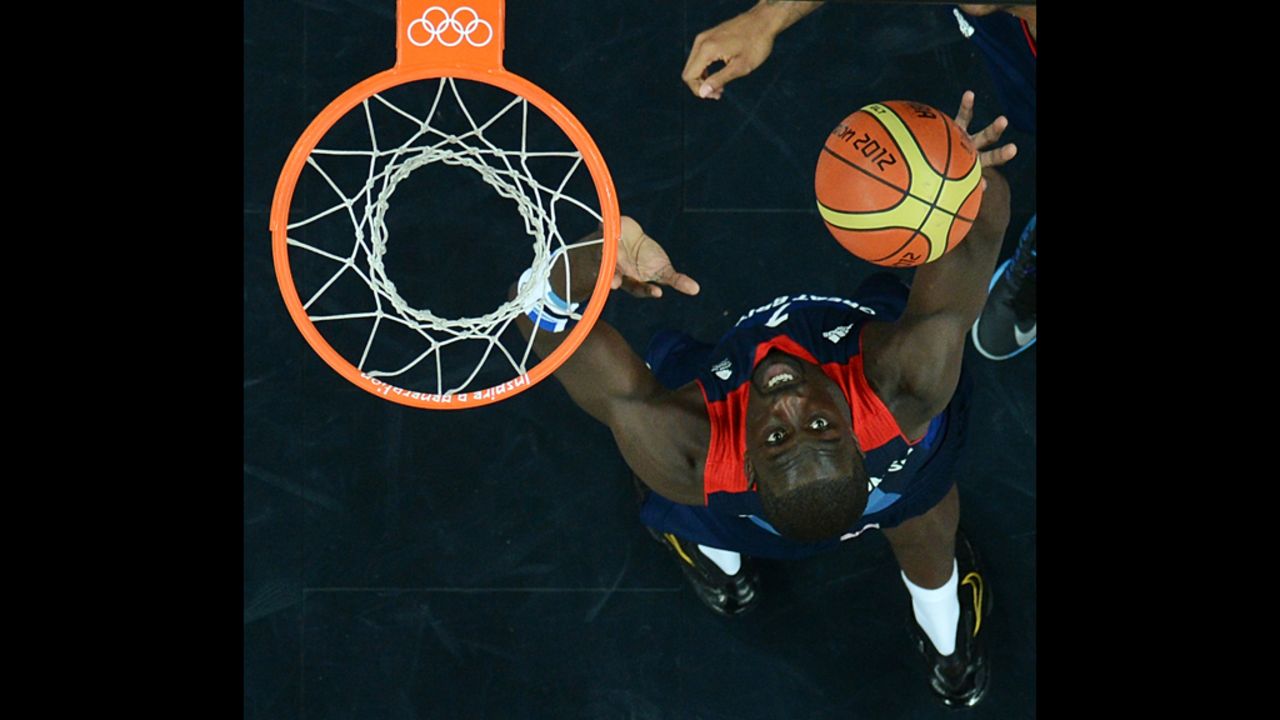 British forward Pops Mensah-Bonsu shoots during the men's preliminary basketball match against Russia.