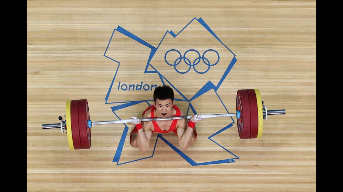 Jingbiao Wu of China takes part in the men's 56-kilogram weightlifting competition.