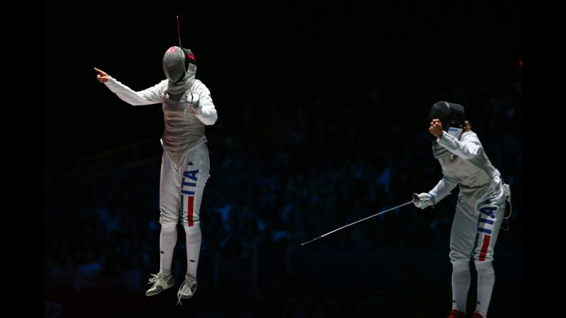 Arianna Errigo, left, of Italy celebrates winning her semifinal fencing match against Valentina Vezzali of Italy in women's individual foil.