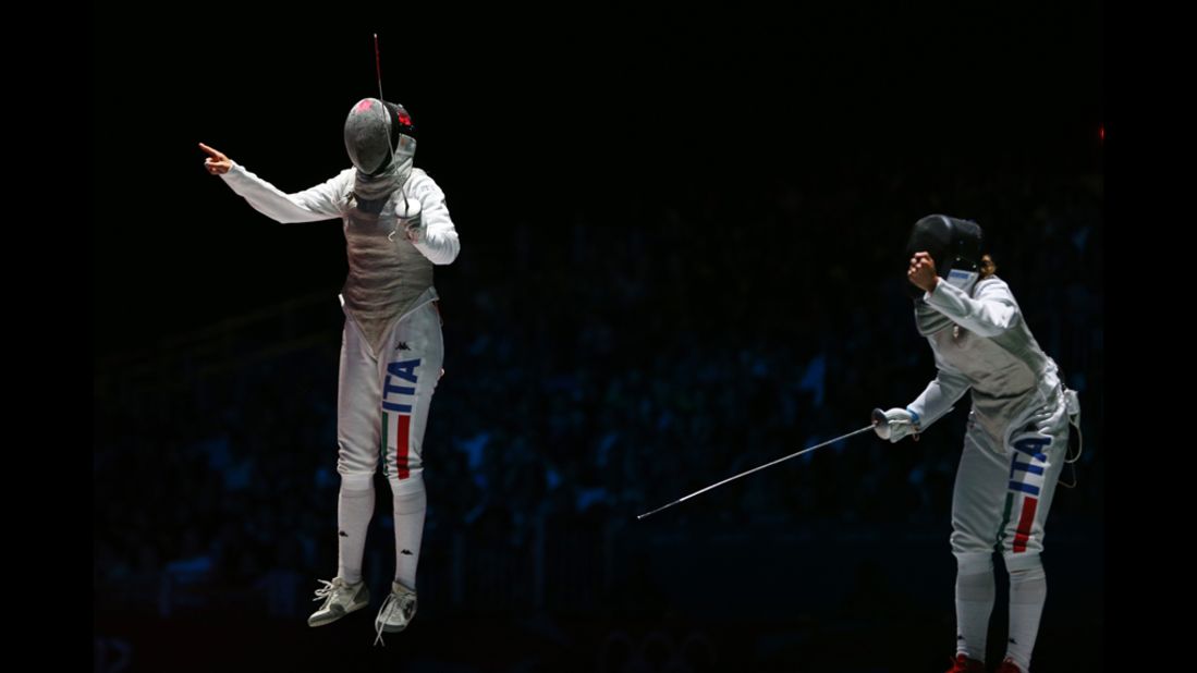 Arianna Errigo, left, of Italy celebrates winning her semifinal fencing match against Valentina Vezzali of Italy in women's individual foil.