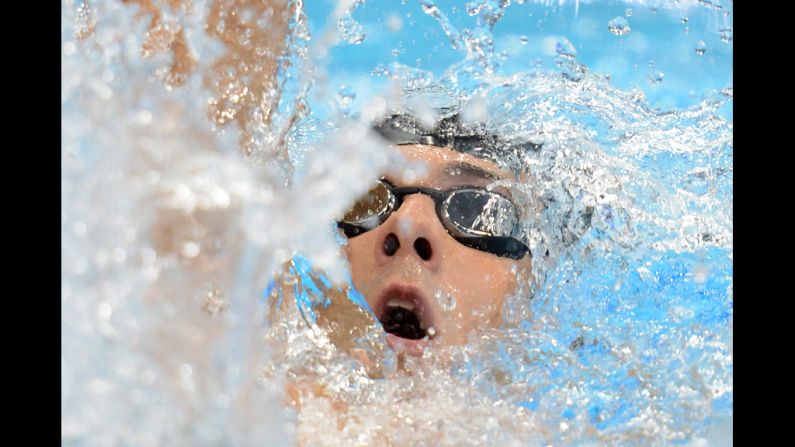 U.S. swimmer Michael Phelps competes in the men's 400-meter individual medley final swimming event during the first day of Olympics competition in London on Saturday, July 28. Phelps failed to medal in the event, finishing fourth. <a href="http://www.cnn.com/2012/07/27/worldsport/gallery/olympic-opening-ceremony/index.html">Photos: The opening ceremony</a>