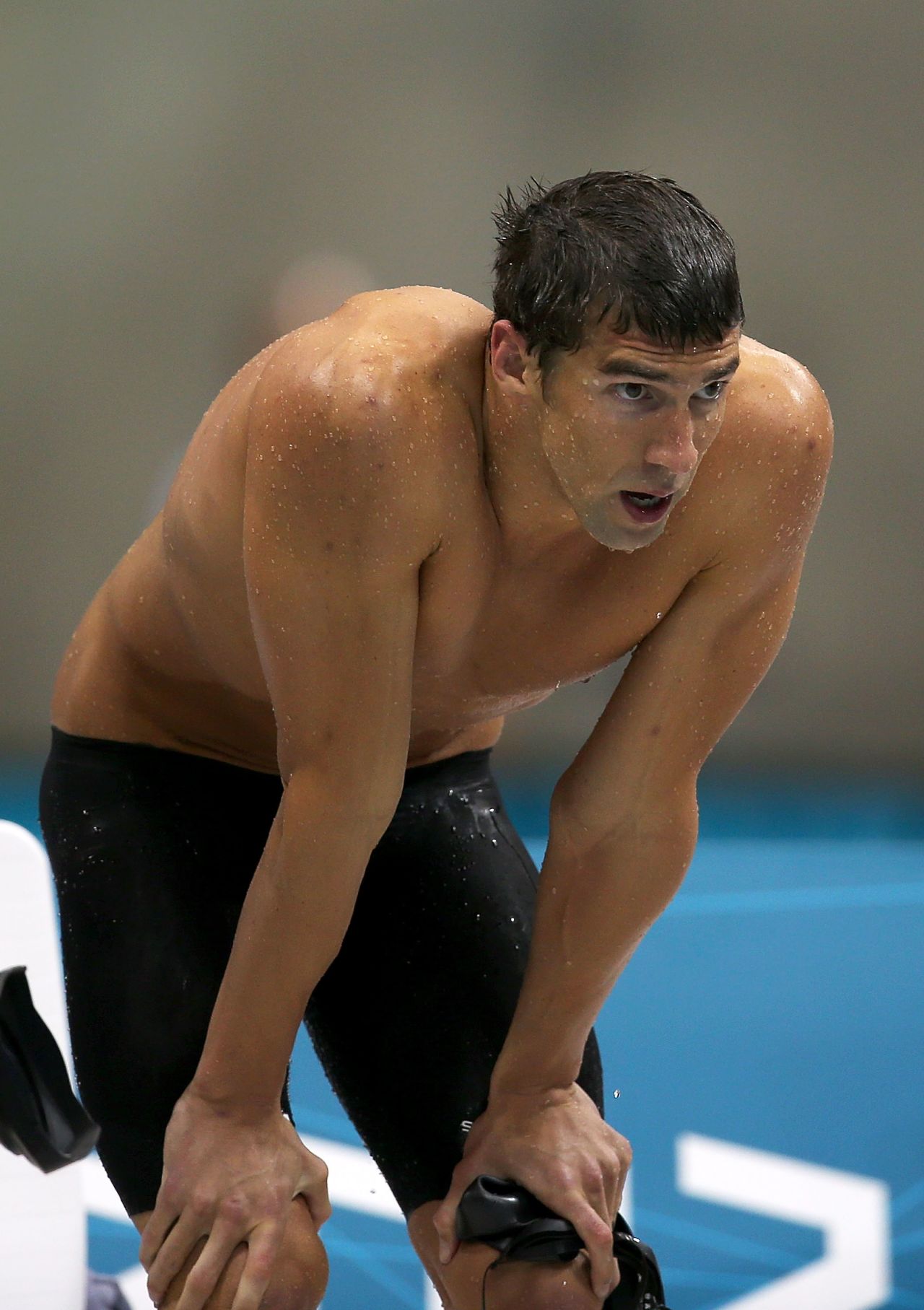 Phelps looks on during the 4x100 freestyle in London.