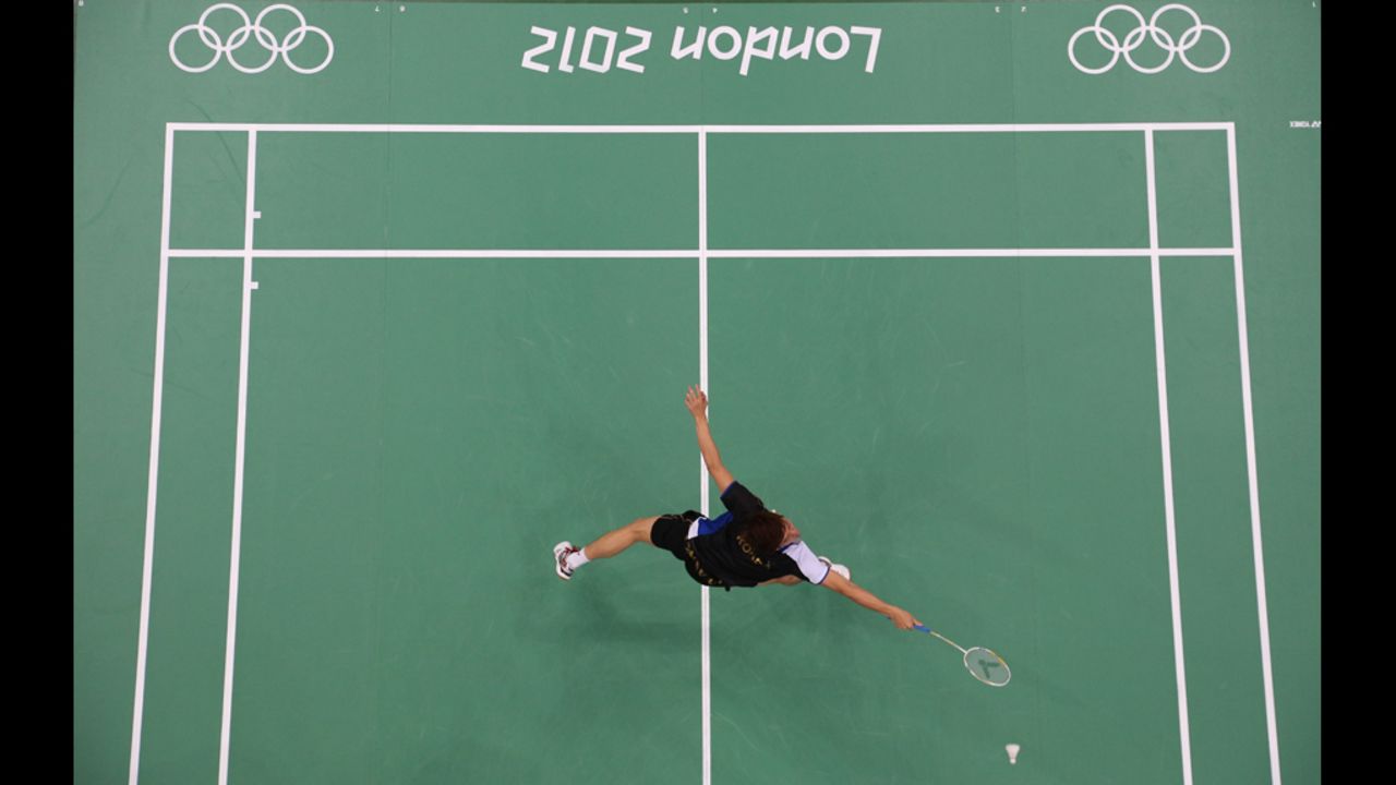 Lee Yong-Dae of South Korea reaches for a shot during the mixed doubles badminton match against Thomas Laybourn and Kamilla Rytter Juhl of Denmark on Monday.
