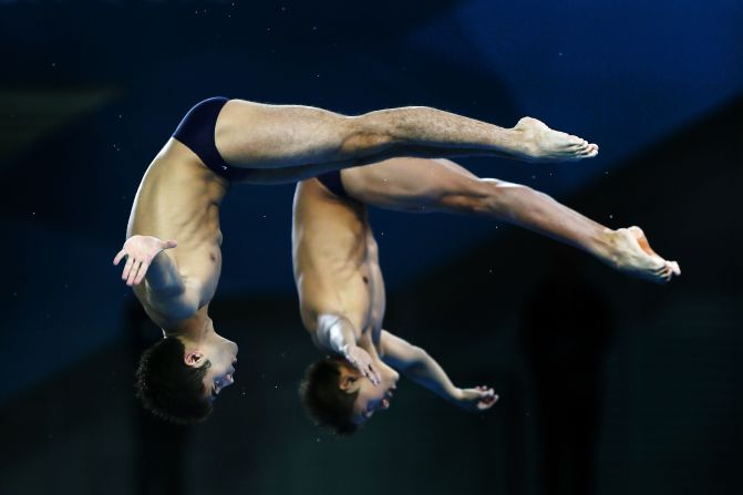 German Sanchez Sanchez and Ivan Garcia Navarro of Mexico compete in the men's synchronized 10-meter platform diving event Monday.