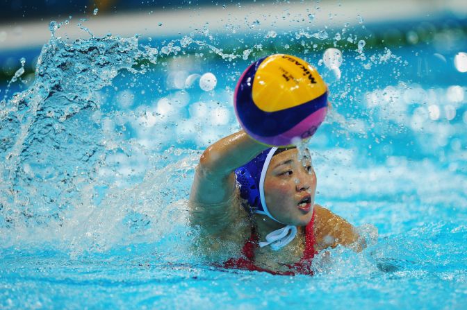 Yujun Sun of China looks to make a pass during the women's water polo preliminary match between Spain and China on Monday.