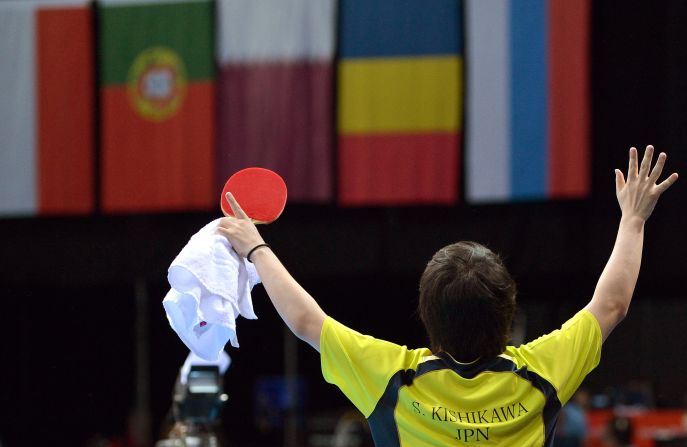 Seiya Kishikawa of Japan celebrates his victory over Panagiotis Gionis of Greece during the men's singles table tennis match Monday.