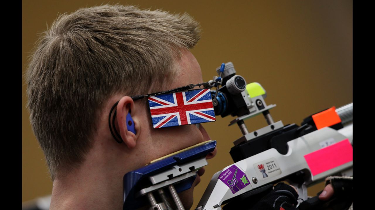 Britain's James Charles Huckle takes a shot during the men's 10-meter air rifle men final on Monday.