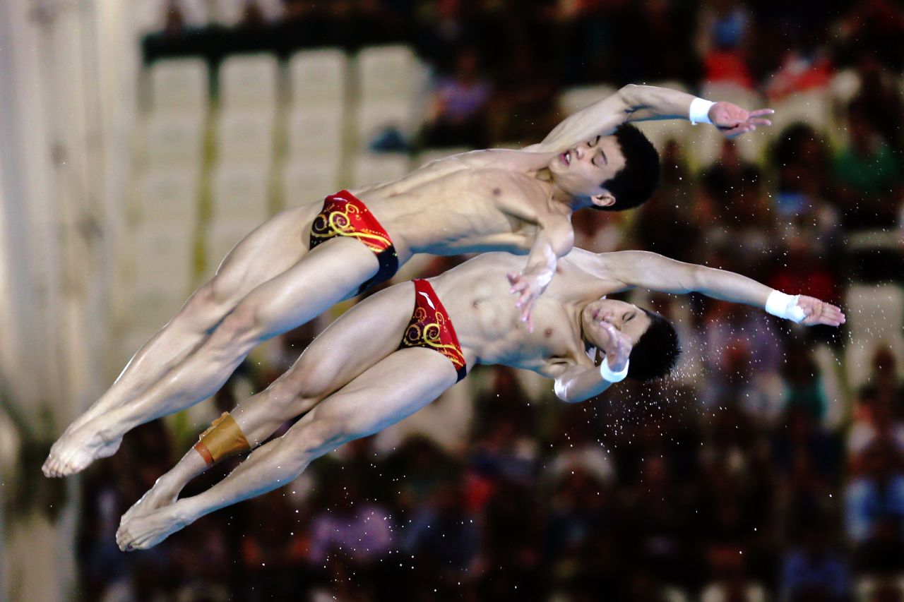Yuan Cao and Yanquan Zhang of China compete in the men's synchronized 10-meter platform diving contest Monday.