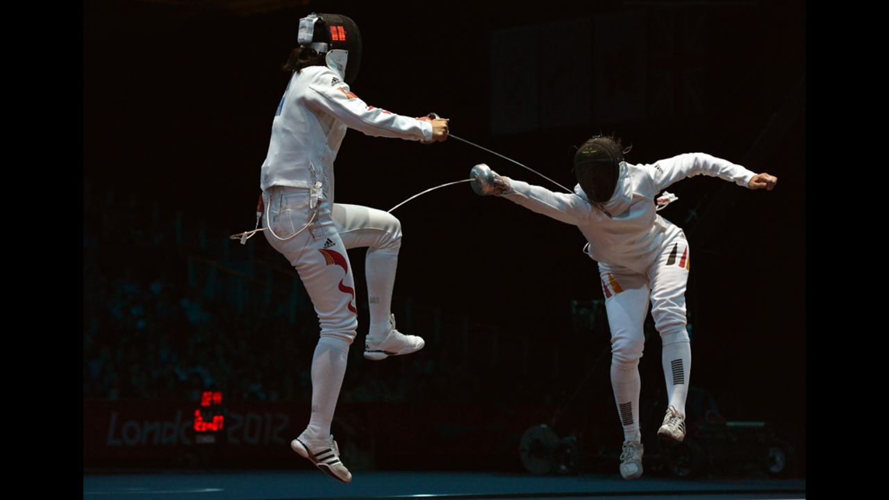 Germany's Britta Heidemann, right, takes on China's Li Na during the women's epee bout Monday.