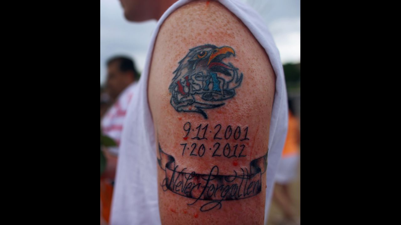 Jeremy Blocker displays a new tattoo honoring the victims.