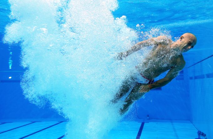 Peter Waterfield of Great Britain comes up for air after diving in the men's synchronized 10-meter platform diving on Monday.