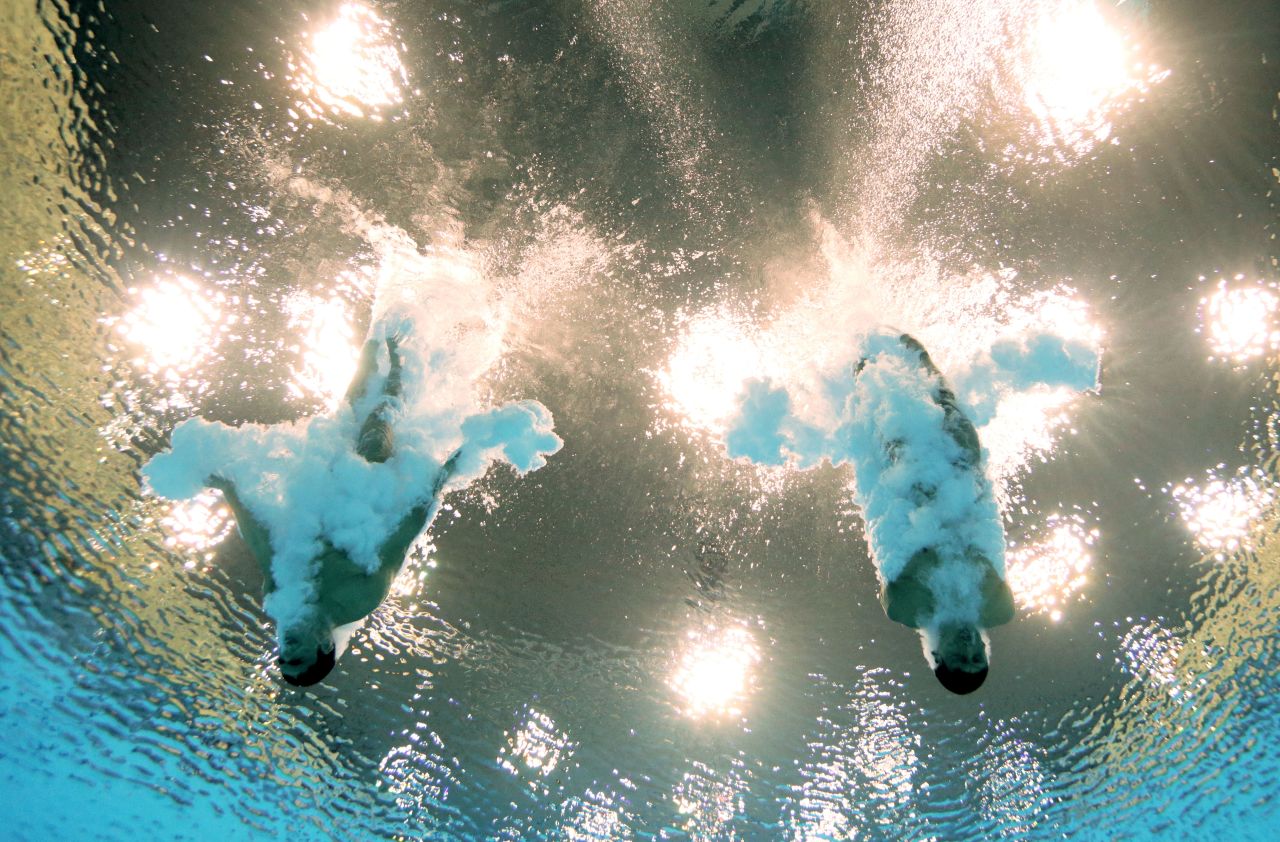 Ivan Garcia Navarro and German Sanchez Sanchez of Mexico plummet into the water in the men's synchronized 10-meter platform diving competition Monday.