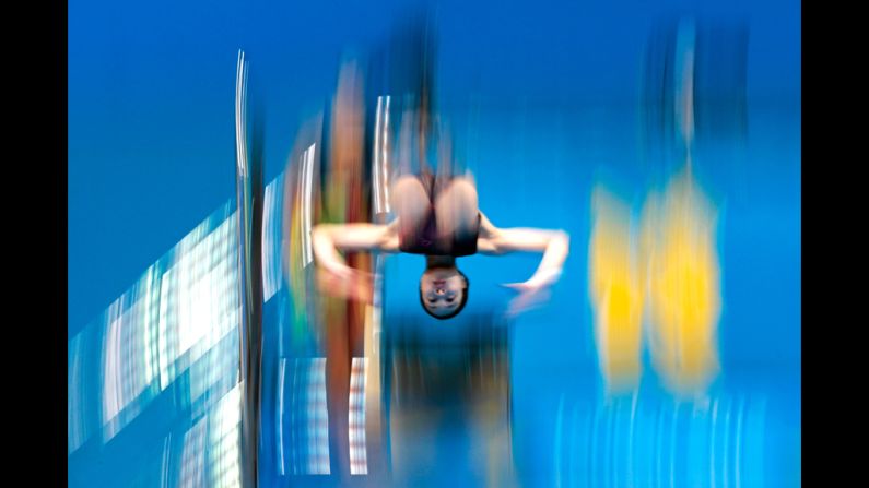 A female diver practices at the aquatics center on Monday.