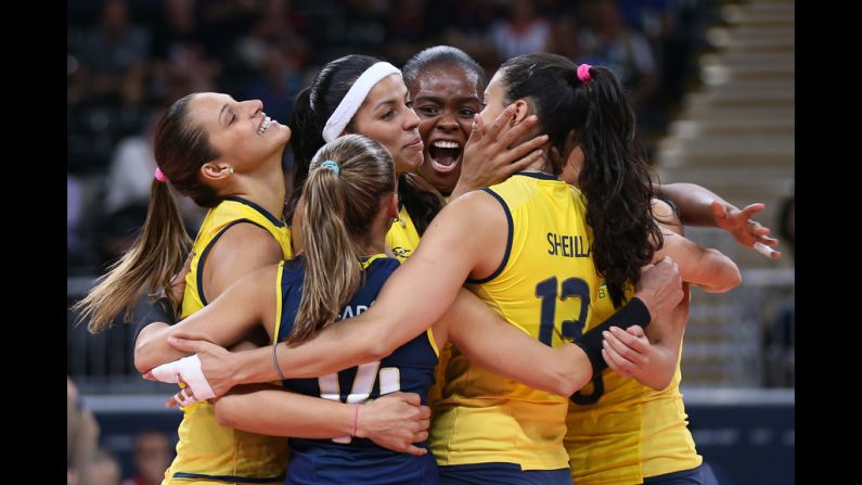 A Brazilian player celebrates winning a point in the women's volleyball preliminary match between the United States and Brazil on Monday.