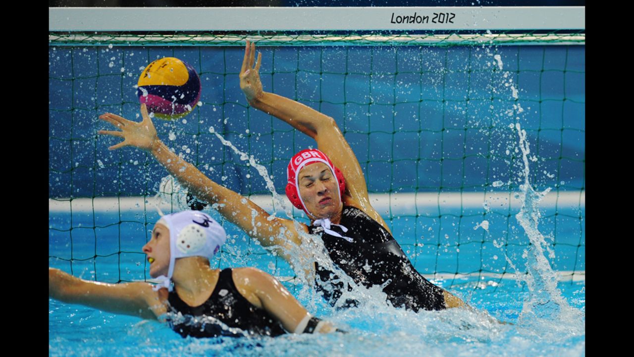 Rosie Morris of Great Britain fails to stop a Russian goal during a women's water polo preliminary match on Monday.