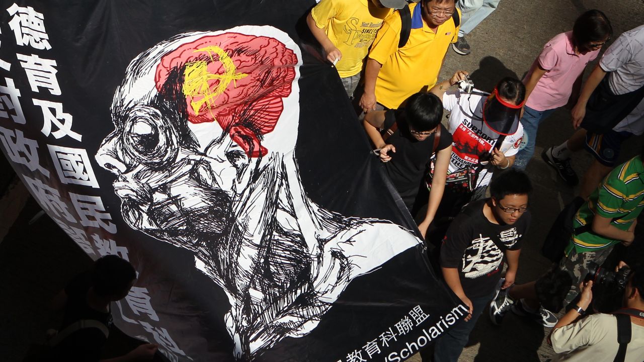 Protester march against  implement national education in Hong Kong, claiming it amounts to Chinese patriotic "brainwashing'.