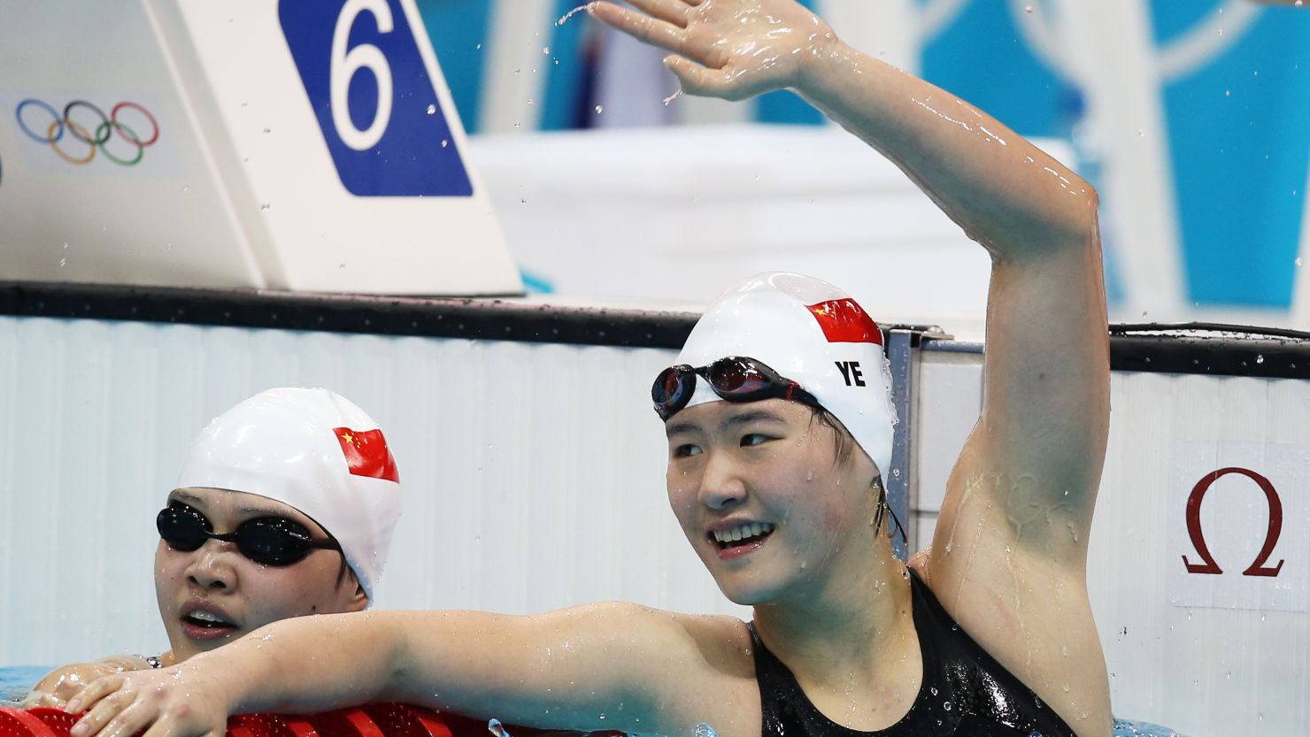 Swimmer Ye Shiwen, 16, raises her hand after winning the 400m race. 