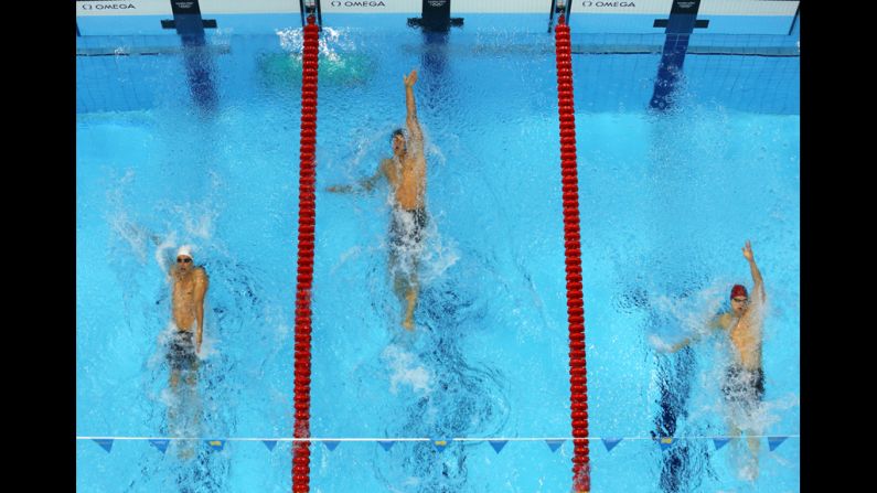 From left, Camille Lacourt of France, Matt Grevers of the United States and Liam Tancock of Great Britain compete the final of the men's 100-meter backstroke on Monday.