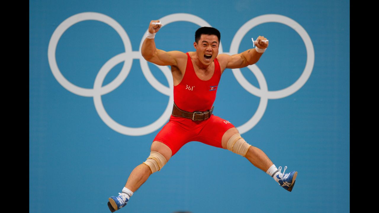 Un Guk Kim of North Korea celebrates his world record while competing in the men's 62-kilogram division weightlifting competition.