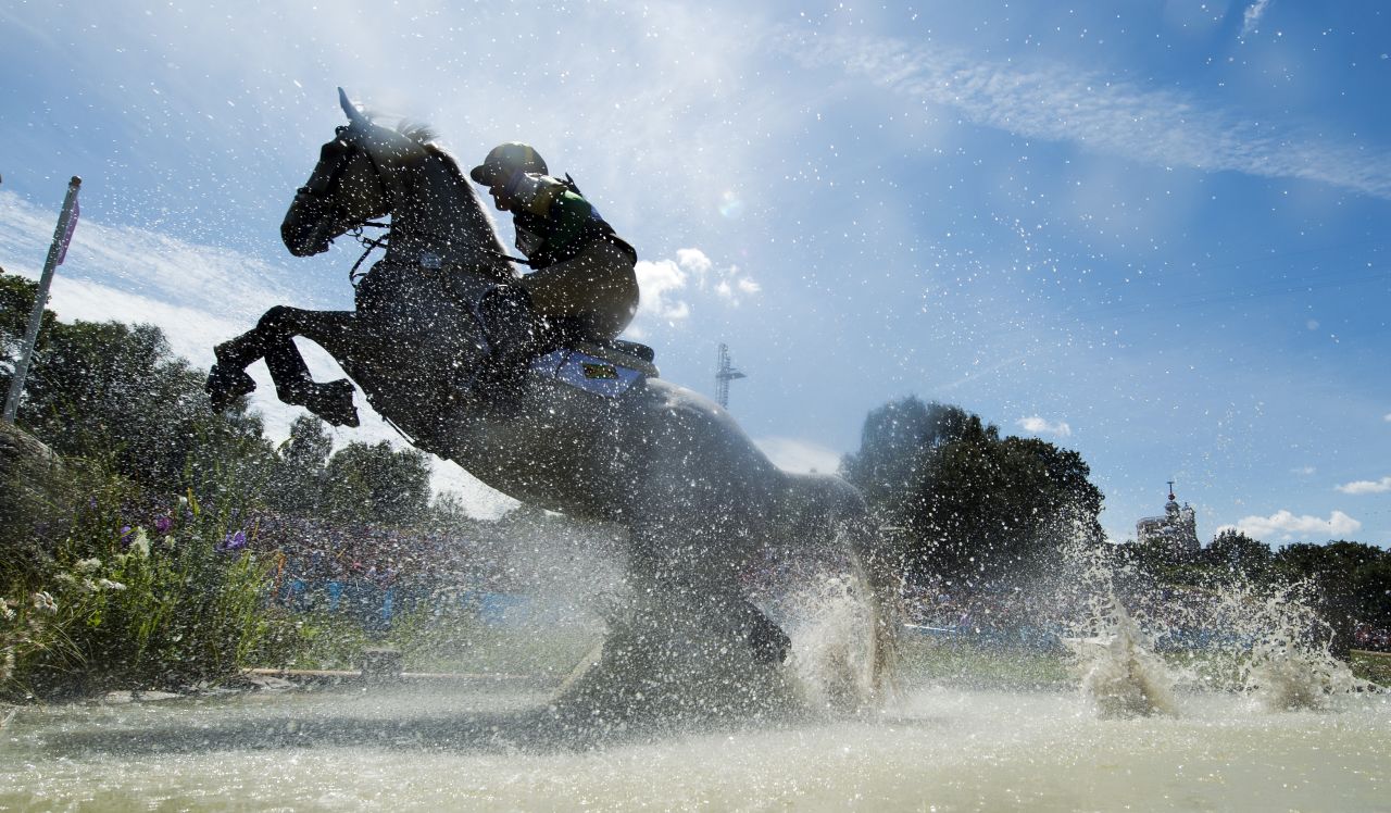 Jamaica's Samantha Albert, riding Carraig Dubh, competes in the cross country phase of the eventing competition.