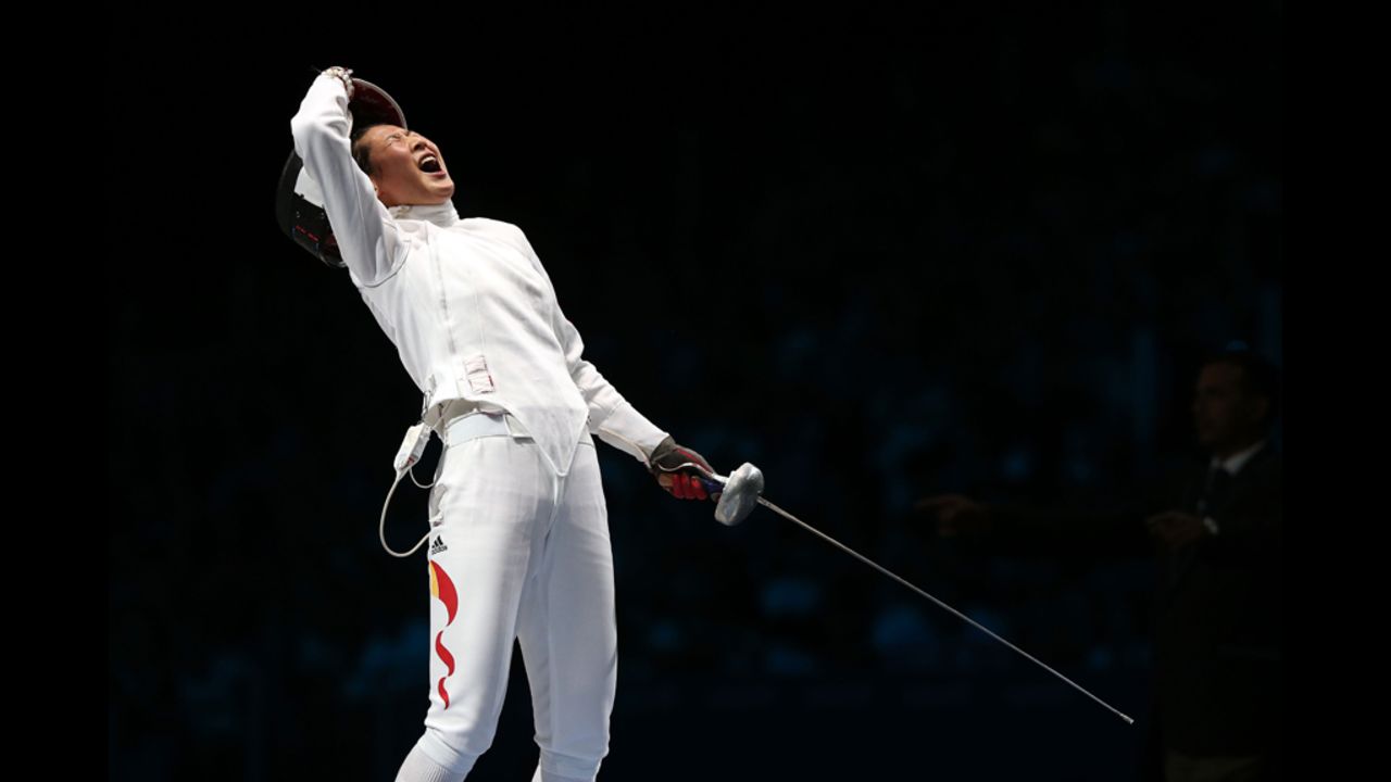 Yujie Sun of China celebrates after defeating A Lam Shin of South Korea to win the bronze medal bout in the women's epee individual fencing competition.