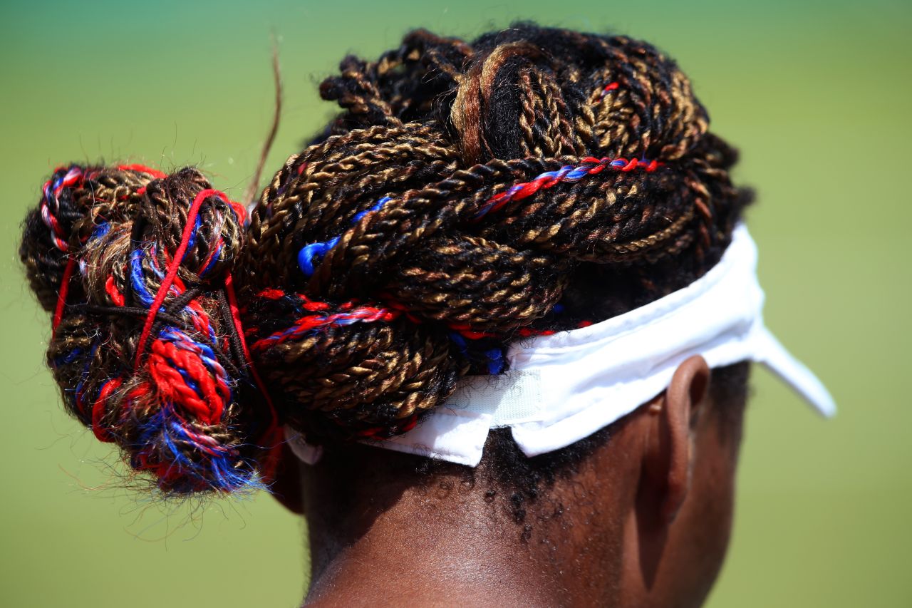 American Venus Williams incorporated her team colors into her hairstyle during her women's singles tennis second round match against Sara Errani of Italy.