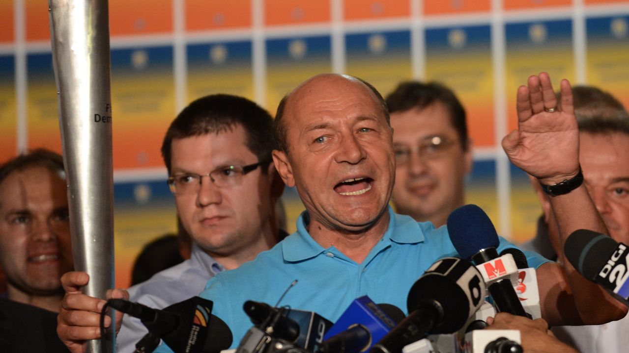 Romanian President Traian Basescu addresses reporters at his electoral campaign headquarters in Bucharest on July 29, 2012. 