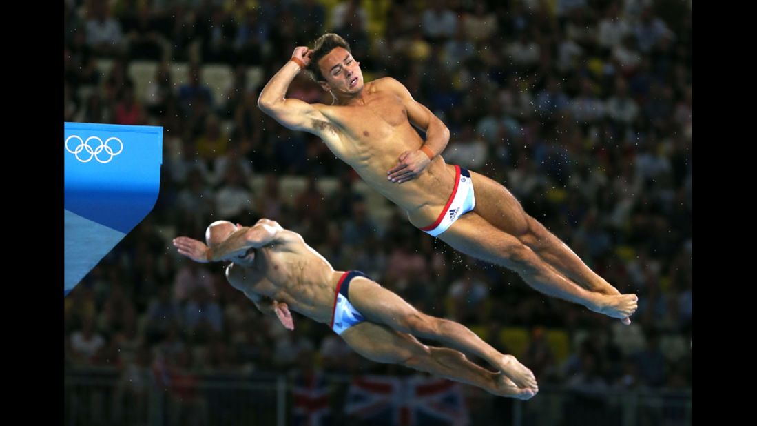 Remembering they're British, divers Tom Daley, right, and Peter Warfield are overcome with embarrassment.