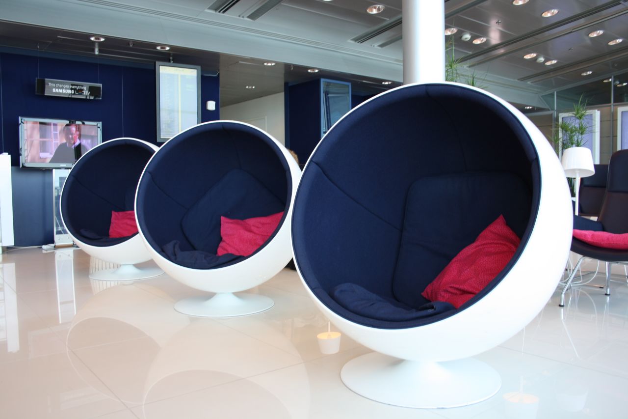Finnish and Nordic furniture designs complement the clean aesthetic at the Finnair Lounge in Helsinki Airport.