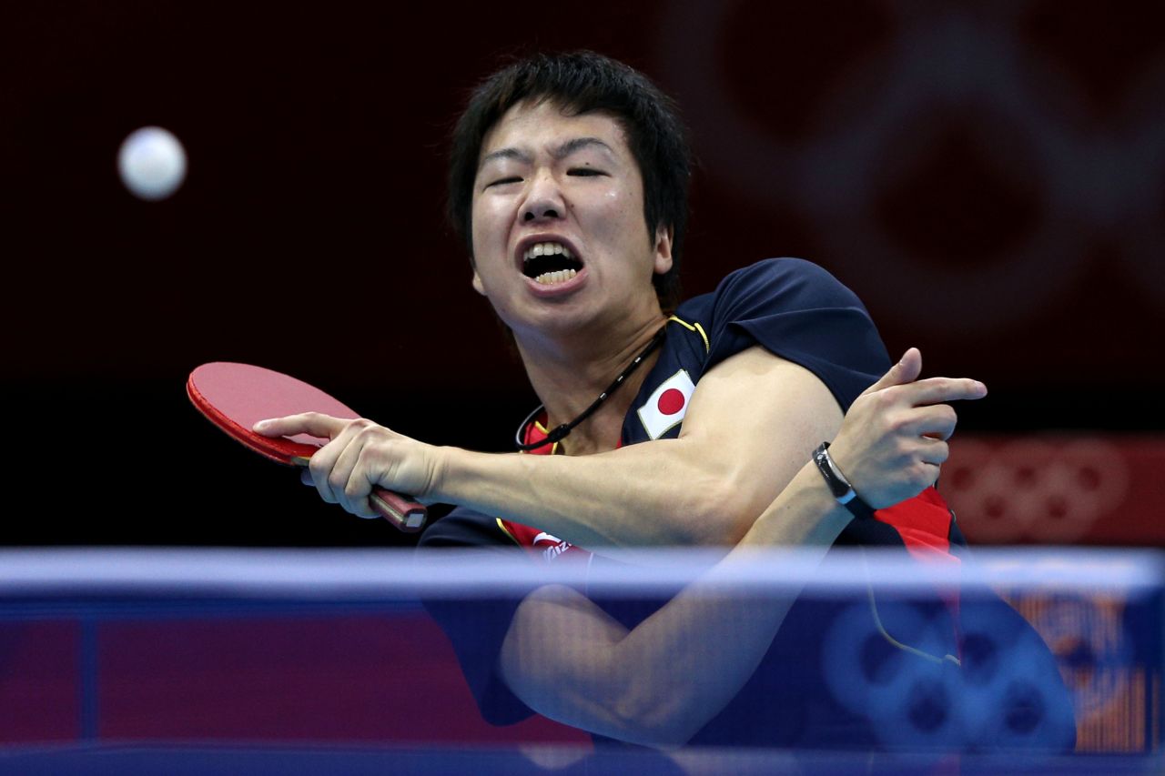 Jun Mizutani of Japan returns the ball during the men's singles table tennis third-round match against Elsayed Lashin of Egypt on Monday.