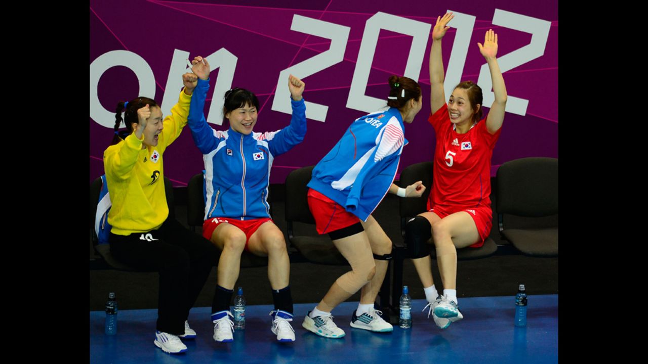 Members of the South Korean women's handball team celebrate after a goal during the preliminary match against Denmark on Monday.