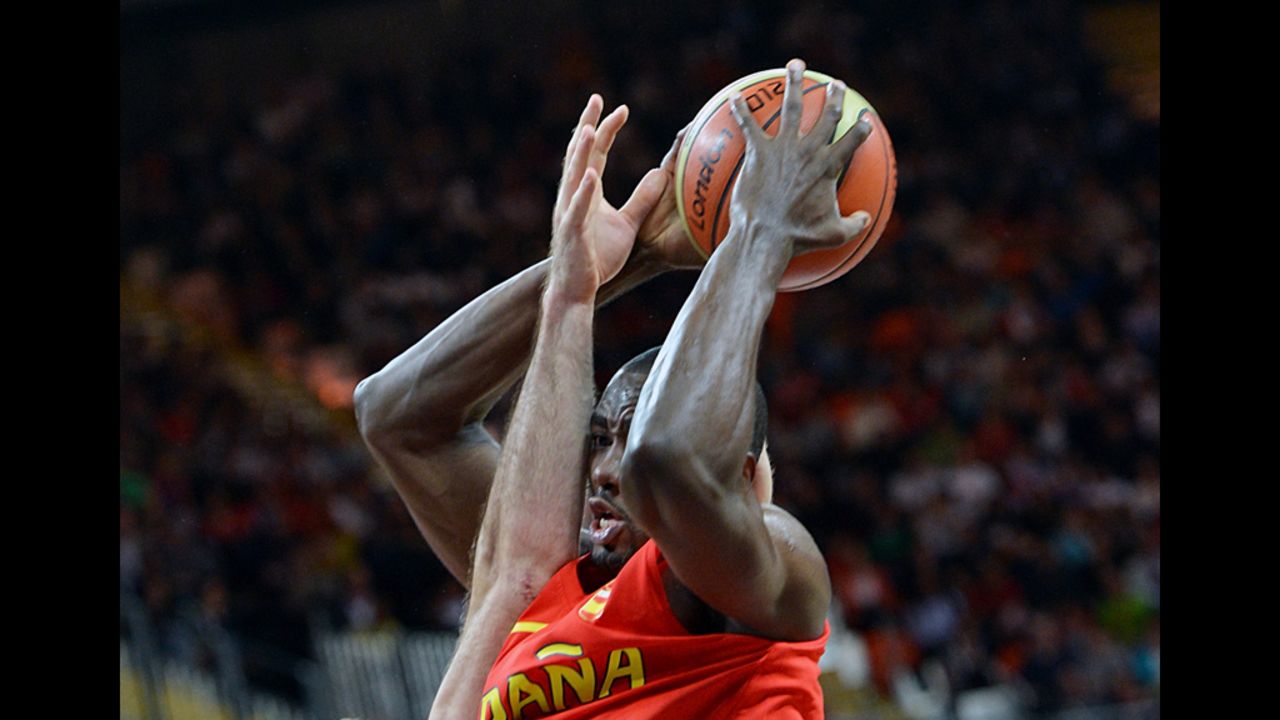 Spanish center Serge Ibaka fights for possession during a men's preliminary round basketball match against Australia on Tuesday.