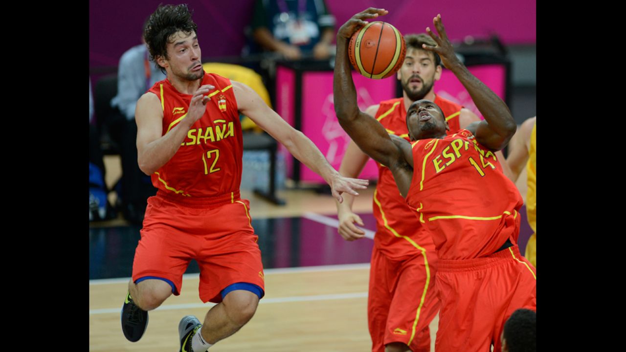 Spanish center Serge Ibaka, right, makes a grab during Tuesday's game against Australia.