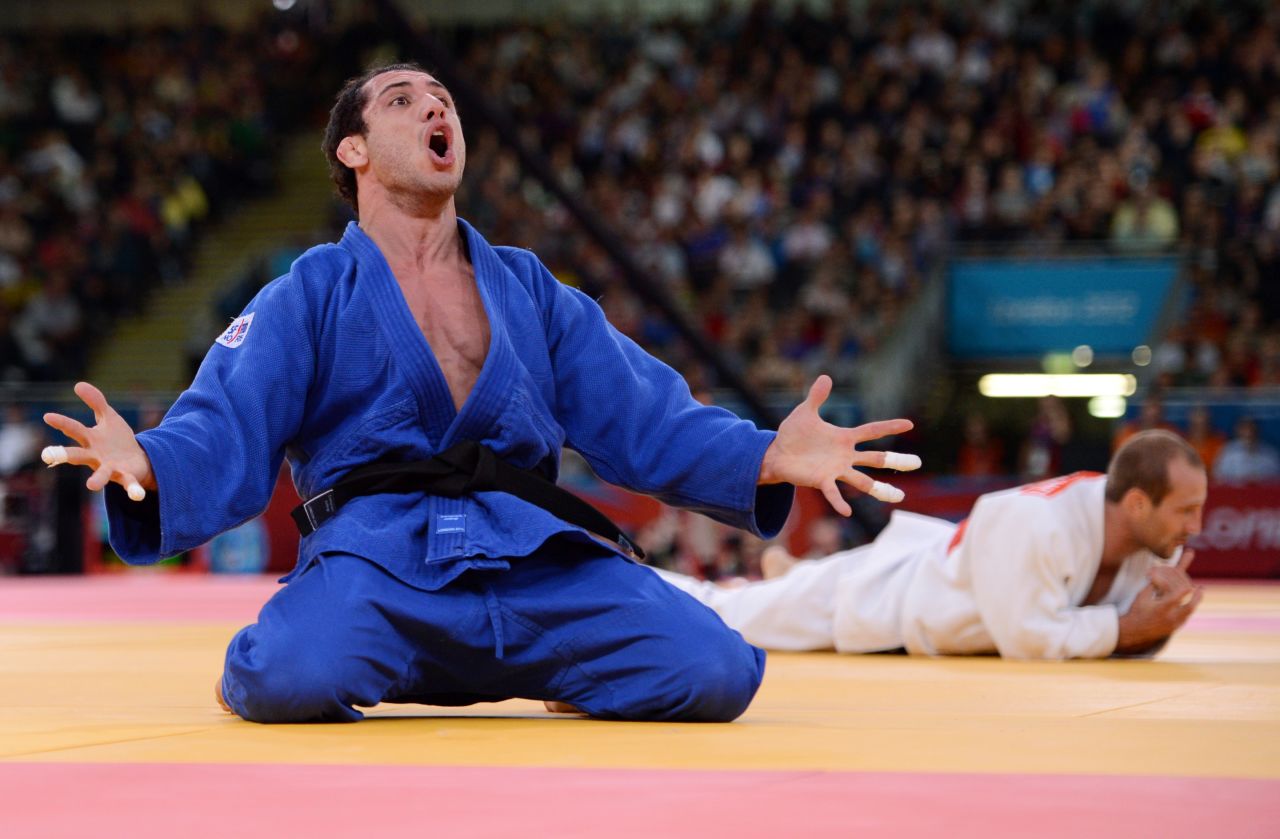 Argentina's Emmanuel Lucenti celebrates after beating France's Alain Schmitt in the men's under 81-kilogram judo contest match Tuesday.