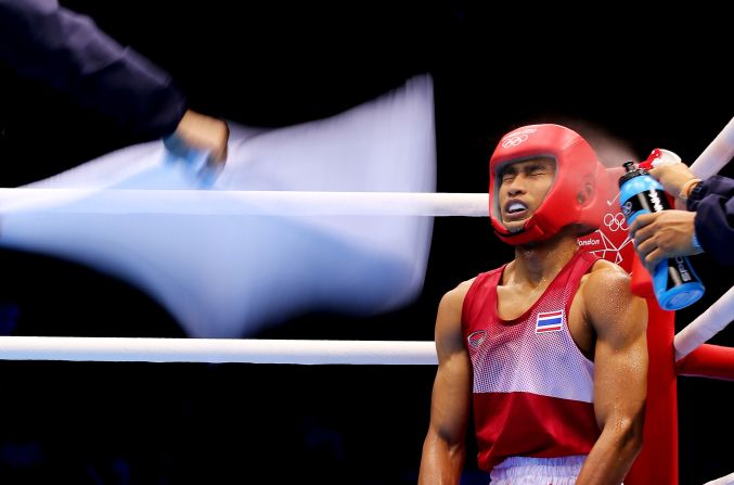 Chatchai Butdee of Thailand sits in his corner during his men's fly boxing bout with Selcuk Eker of Turkey on Monday, July 30, on Day 3 of the London 2012 Olympic Games. <a href="index.php?page=&url=http%3A%2F%2Fwww.cnn.com%2F2012%2F07%2F29%2Fworldsport%2Fgallery%2Folympics-day-two%2Findex.html" target="_blank">Check out Day 2 </a>of competition from Sunday, July 29. The Games run through August 12. See all the action as it unfolds here.