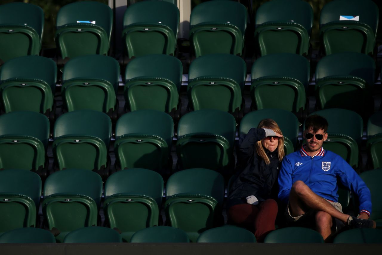 Spectators watch the action on Monday at the All England Lawn Tennis and Croquet Club in Wimbledon.