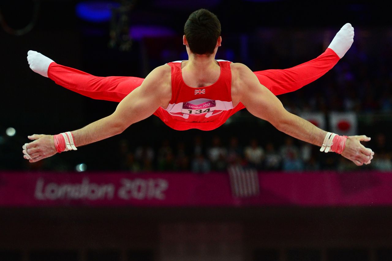 British gymnast Kristian Thomas competes at the horizontal bar during the men's team final of the artistic gymnastics event .