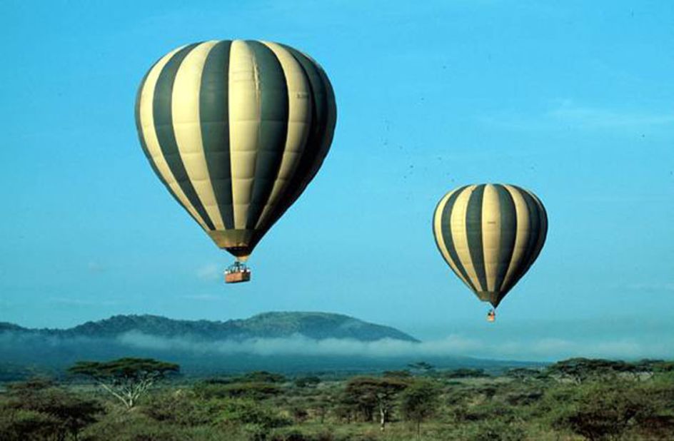 After bumping along the plains of the Serengeti at dawn, passengers take flight in balloons, where they can exercise their wildlife photography skills. 