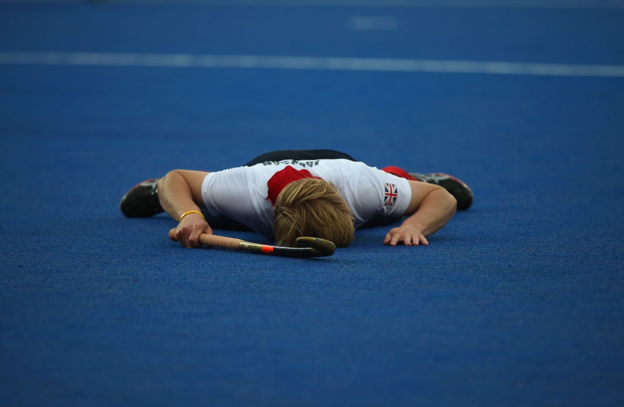 Ashley Jackson of Great Britain lays on the floor after missing a shot during the men's field hockey match between Great Britain and Argentina on Monday.
