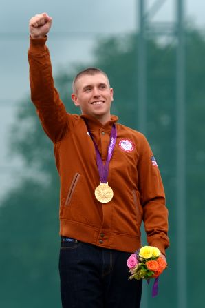 Vincent Hancock shows off his gold medal in men's skeet shooting Tuesday. 