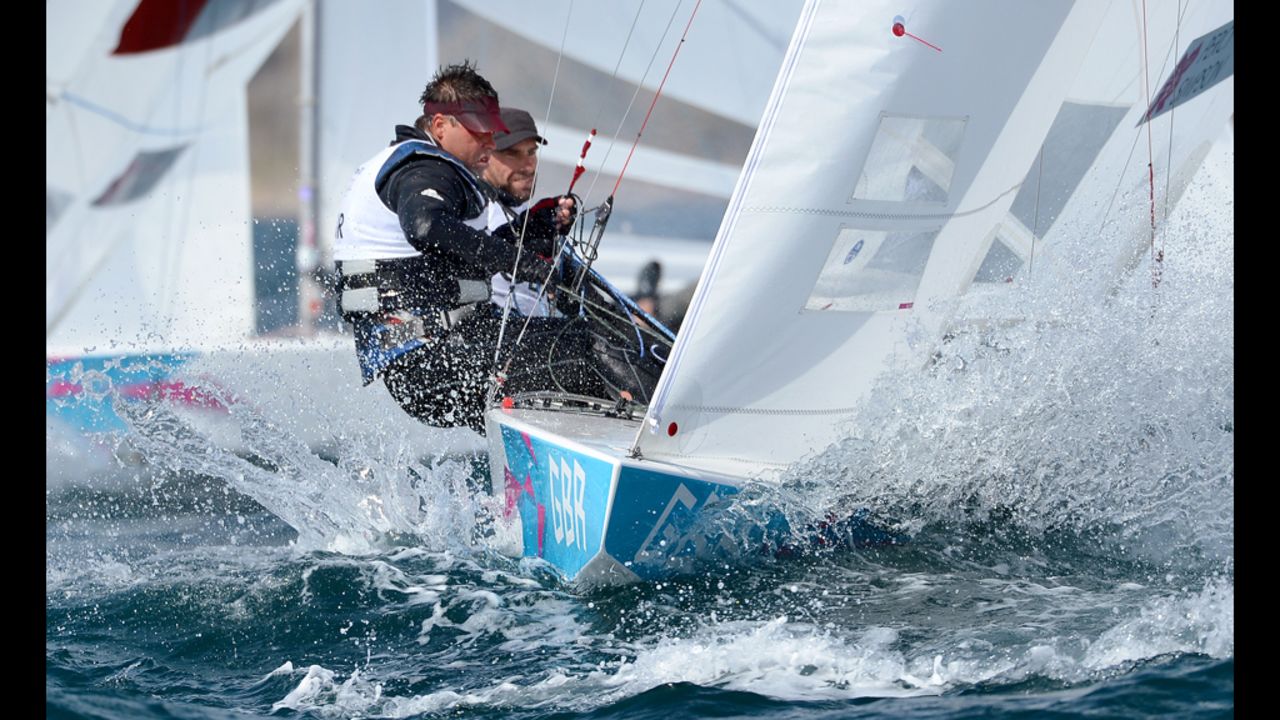 Britain's Andrew Simpson and Iain Percy round the mark in the star sailing class.