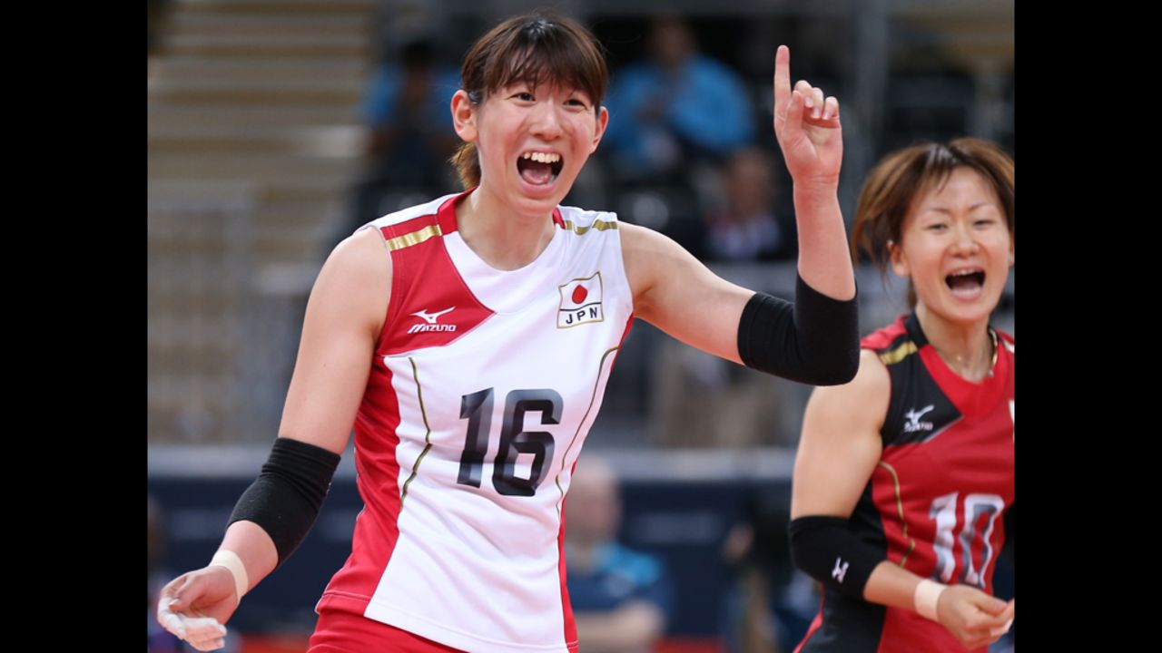 Yukiko Ebata of Japan celebrates winning a point in the women's volleyball preliminary match between Italy and Japan.