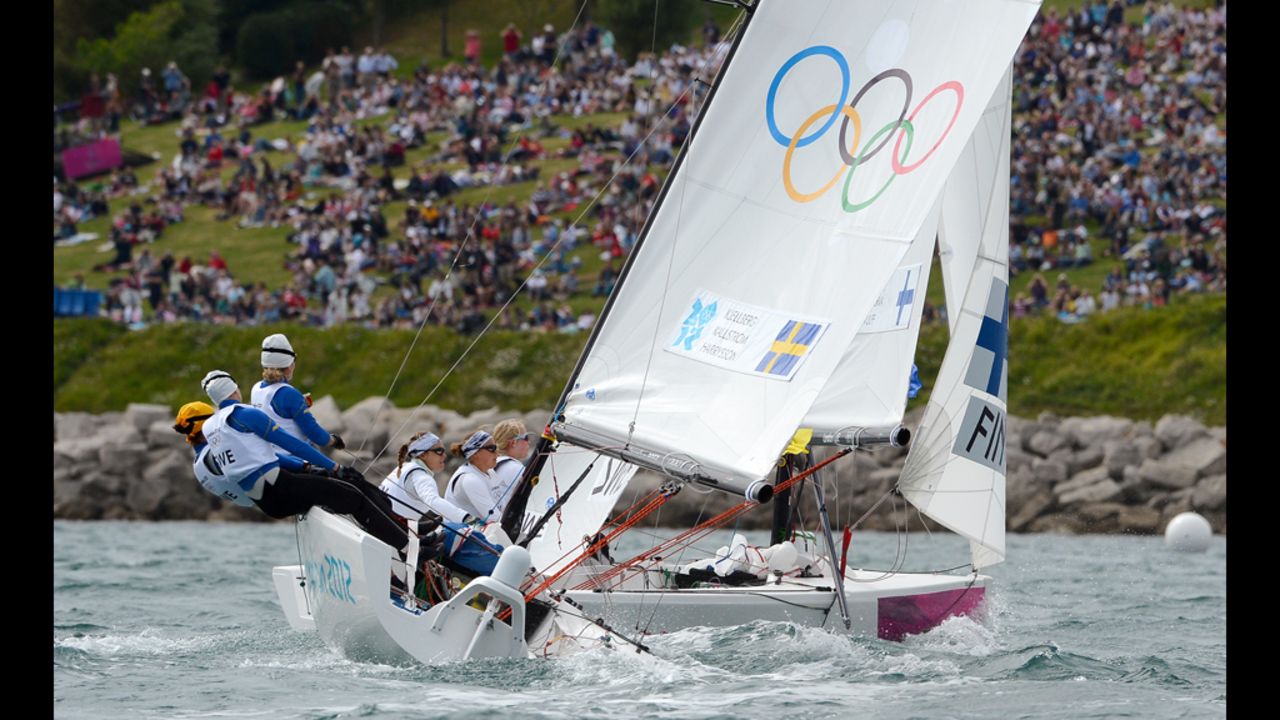 Britain's Andrew Simpson and Iain Percy round the mark in the star sailing class.