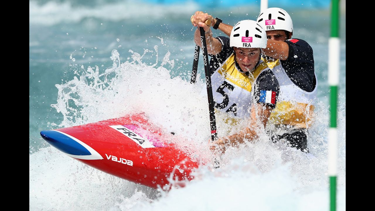 Gauthier Klauss and Matthieu Peche of France compete in the men's canoe double slalom heats.